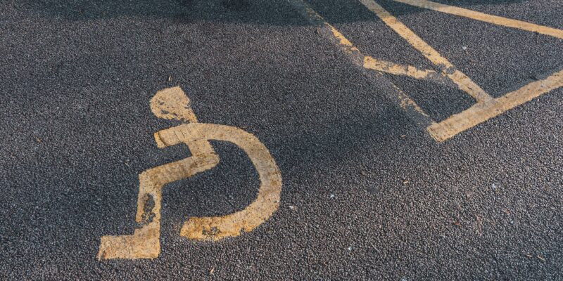disability marking on asphalt pavement